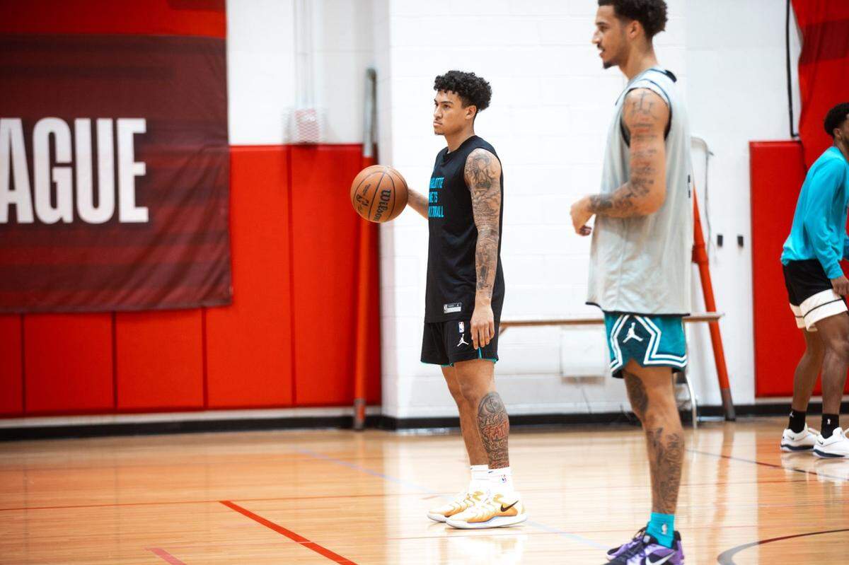 Charlotte Hornets rookie KJ Simpson looks on during an NBA summer league practice on July 11, 2024.