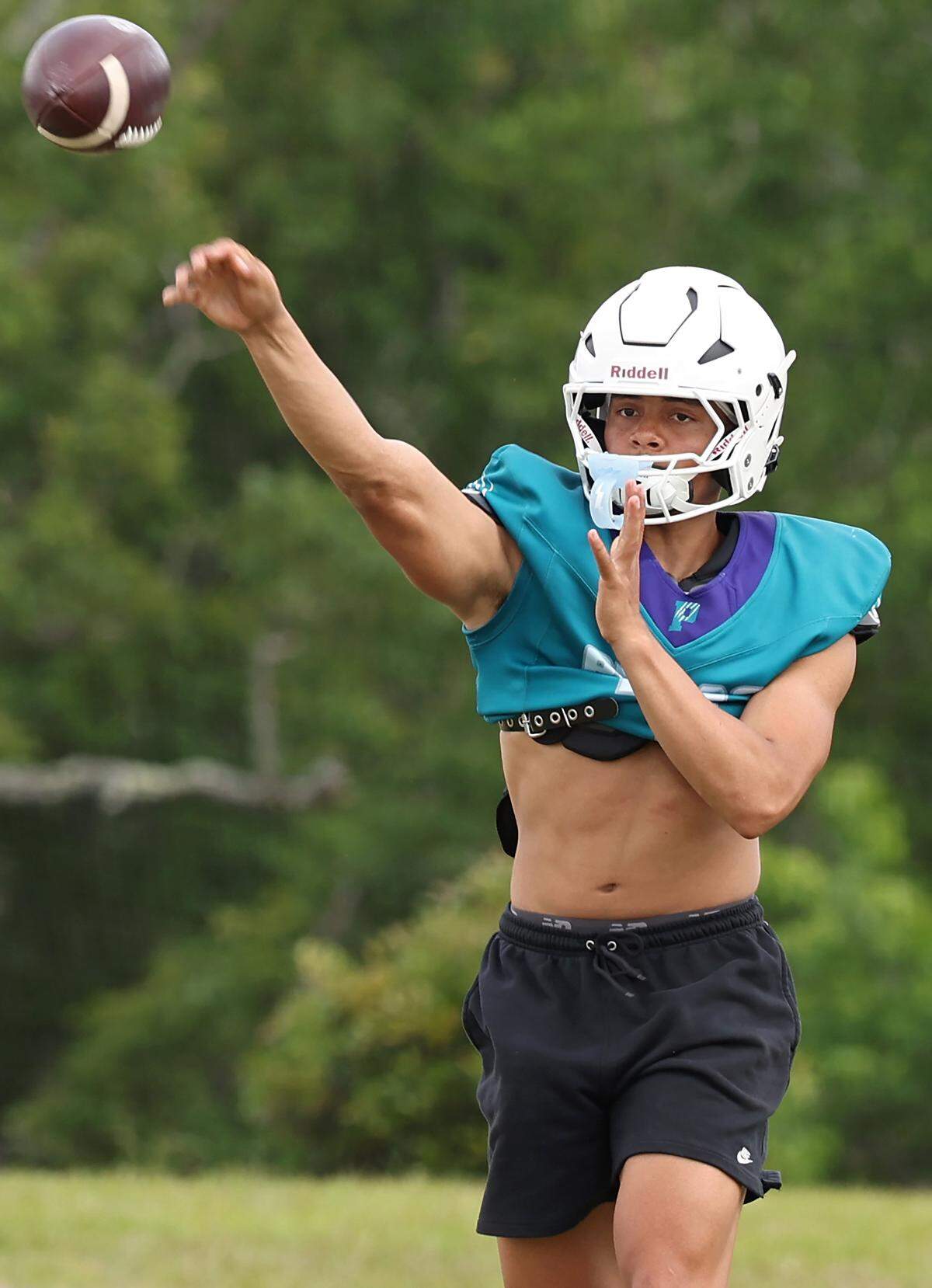Palisades Pumas quarterback Cole Hough passes to a receiver during a spring workout on Thursday, April 30, 2026. Palisades is going for its third straight winning season and wants to jump into the upper echelon of Charlotte teams.