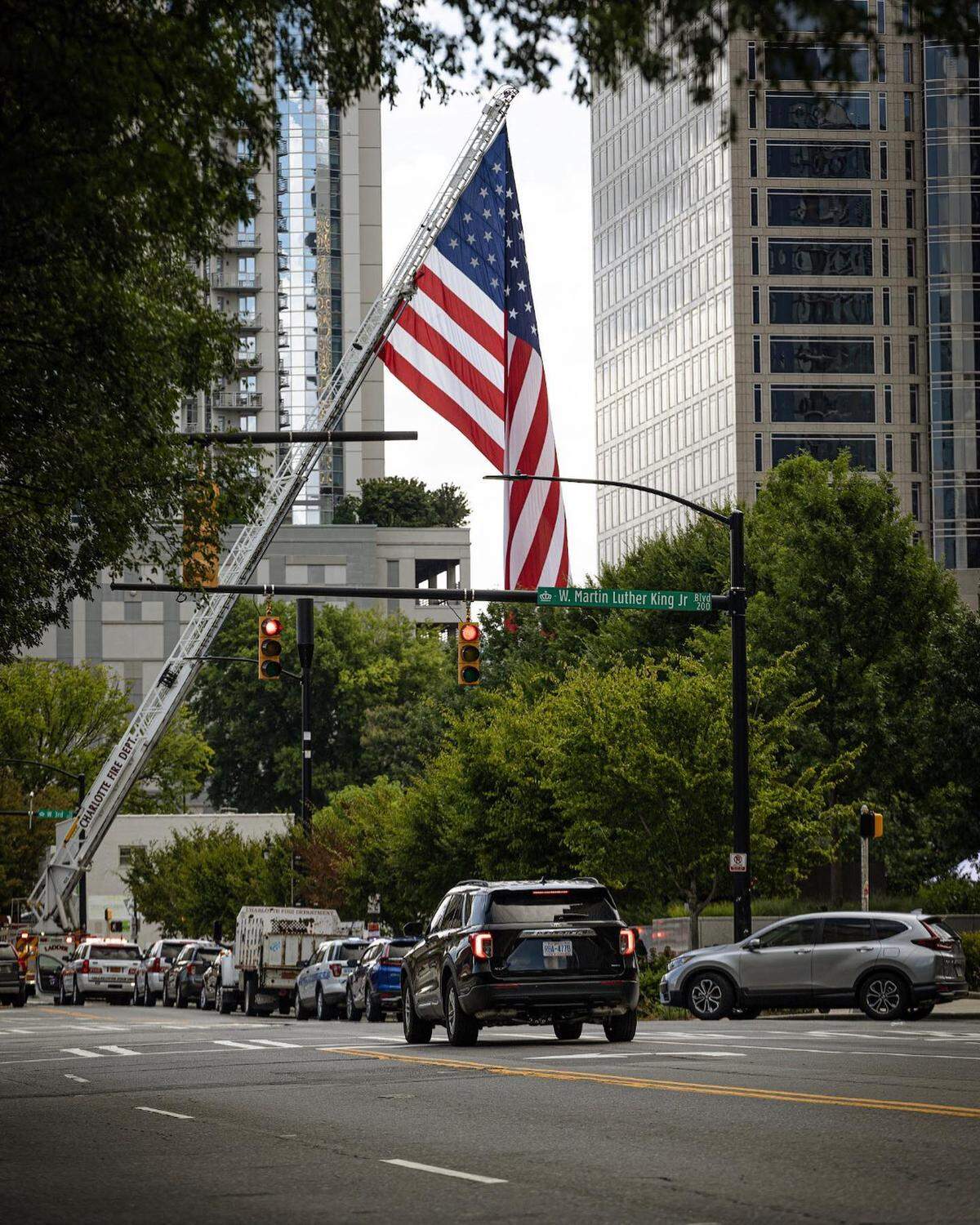 An American flag waves over uptown Charlotte during the U.S. Veterans Hall of Fame’s fourth annual Walk to Fight Suicide on Saturday Aug. 6, 2022. The event saw lower turnout than previous years due to a parking issue.
