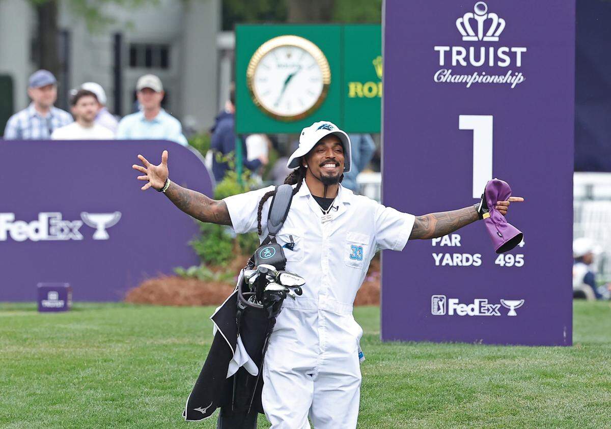 Former Carolina Panthers safety Tre Boston is ready to go as former fullback Mike Tolbert's caddie during the Truist Championship Pro-Am at Quail Hollow Club in Charlotte, NC on Wednesday, May 6, 2026.