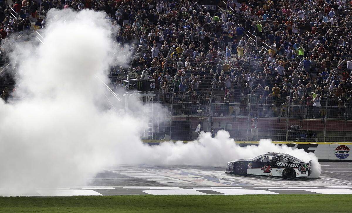 Kevin Harvick does a burnout after winning the NASCAR All-Star auto race at Charlotte Motor Speedway in Concord on Saturday.