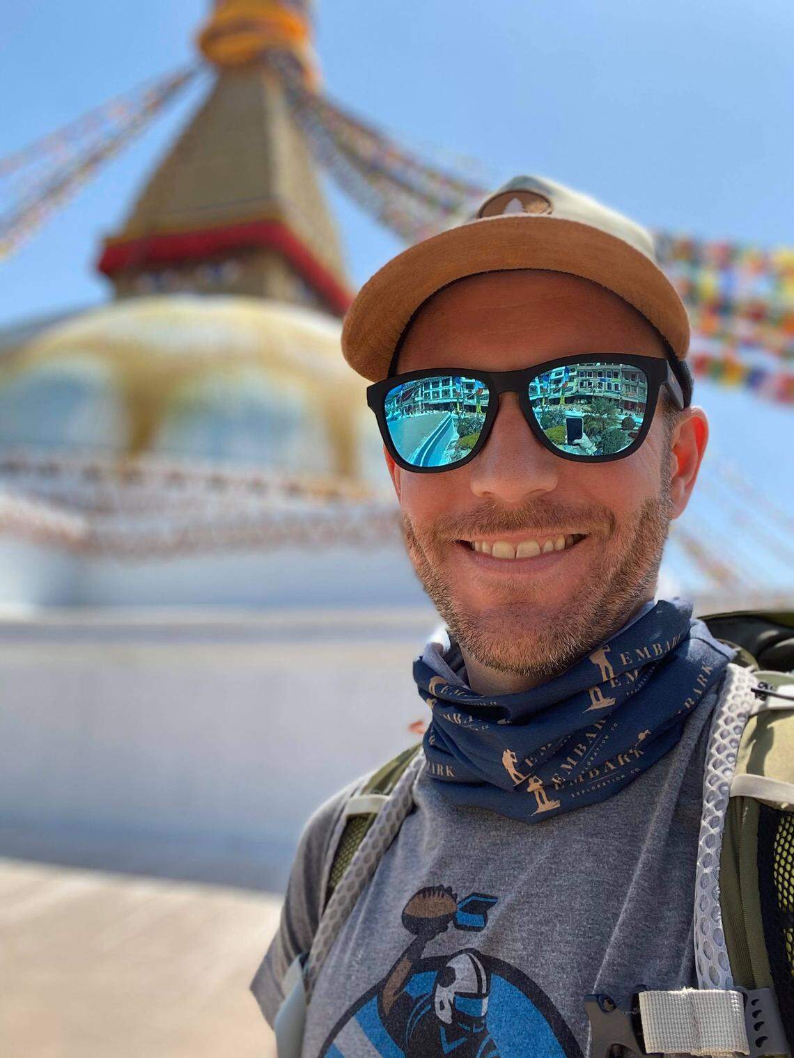 Matthew Barnhill, photographed in Nepal earlier this week, with the Boudhanath Stupa in the background.