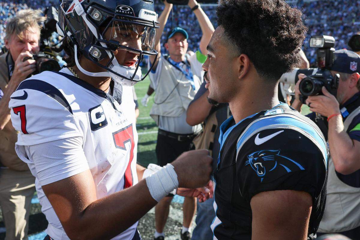 Houston Texans quarterback C.J. Stroud, left, gives a fist bump to Carolina Panthers quarterback Bryce Young after the game at Bank of America Stadium on Sunday, October 29, 2023. Young and the Panthers got their first win of the season over the Texans, 15-13.