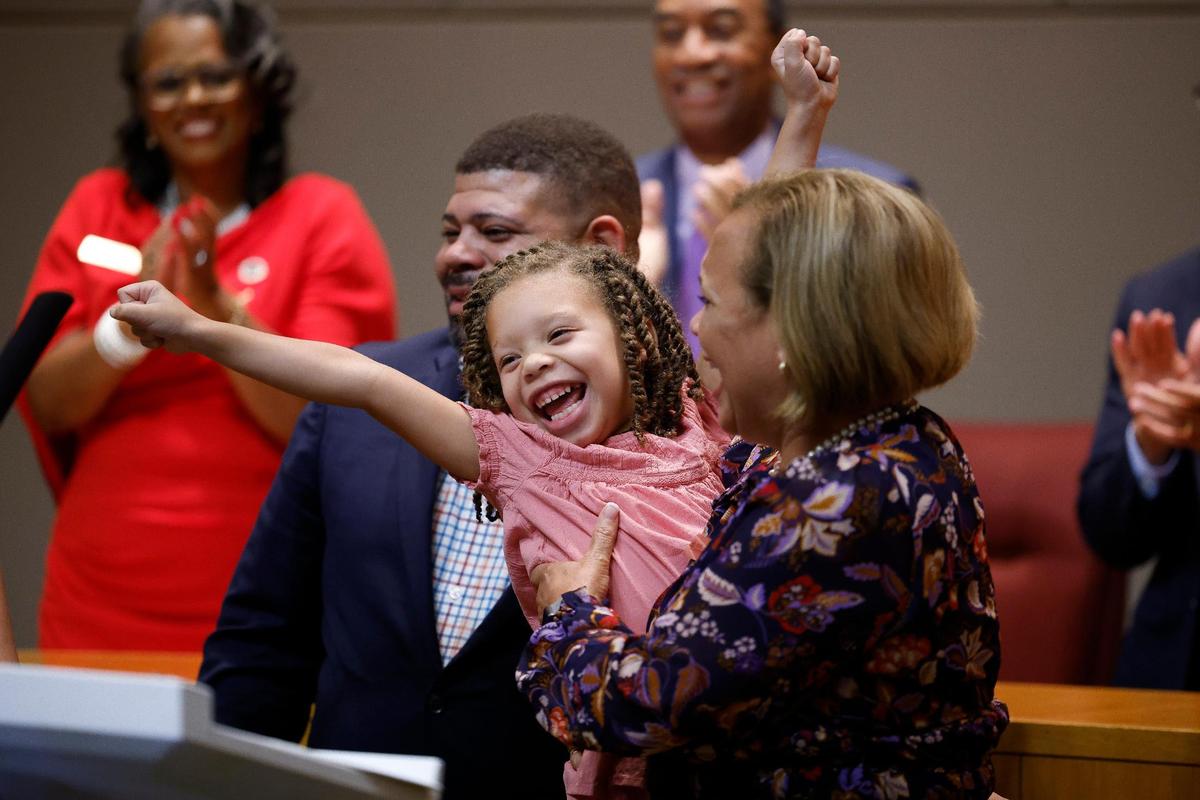Charlotte Mayor Vi Lyles celebrates a new term with her granddaughter Arya Alexander, 6, after taking the oath of office at the Charlotte-Mecklenburg Government Center in Charlotte, N.C., Tuesday, Sept. 6, 2022.