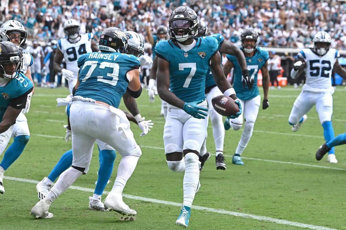 Jacksonville Jaguars wide receiver Brian Thomas Jr., center, smiles as he runs into the end zone for a touchdown during action against the Carolina Panthers on Sunday, September 7, 2025 at Everbank Stadium in Jacksonville, Florida. The Jaguars defeated the Panthers 26-10.