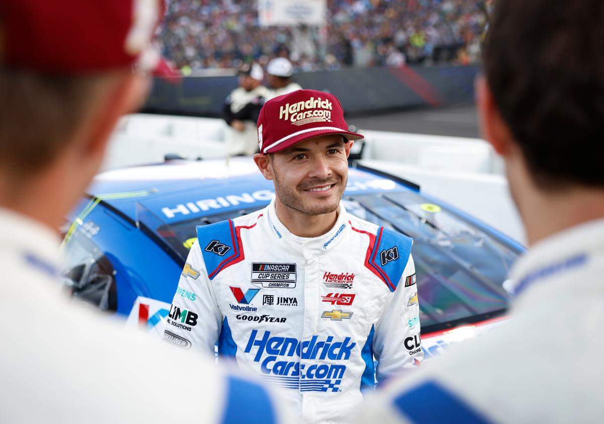 NASCAR Cup Series driver Kyle Larson, center, spends time with his crew prior to competing in the NASCAR All-Star race at North Wilkesboro Speedway in North Wilkesboro, NC on Sunday, May 19, 2024. Larson had earlier qualified fifth for the Indianapolis 500.