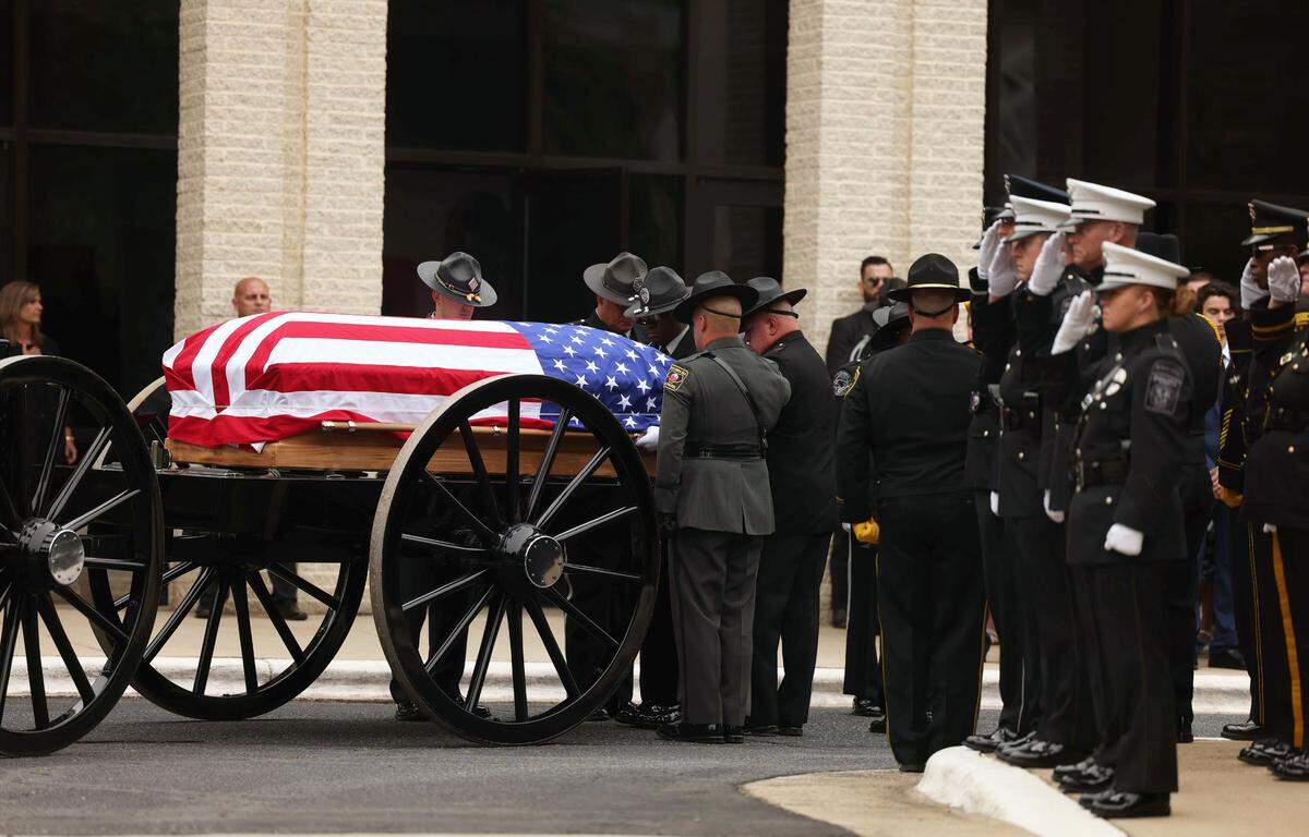 A casket&nbsp;for Investigator Sam Poloche of the N.C. Department of Adult Correction enters at the First Baptist Church in Charlotte for the memorial service on Monday, May 13, 2024. Poloche killed in the line of duty while serving a warrant in east Charlotte on Monday April 29, 2024.