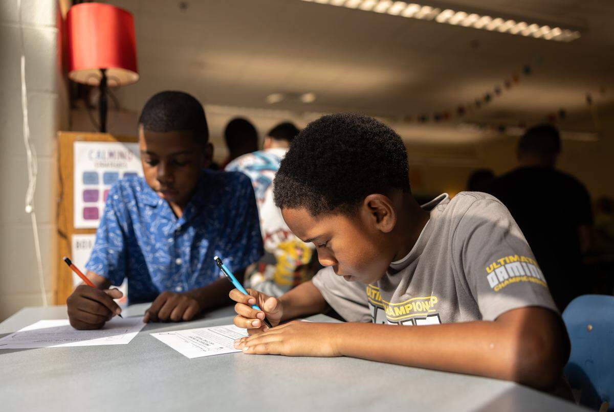 Students get started on their first assignment of the day during the first day of school at Elizabeth Traditional School in Charlotte, N.C., on Monday, August 25, 2025.