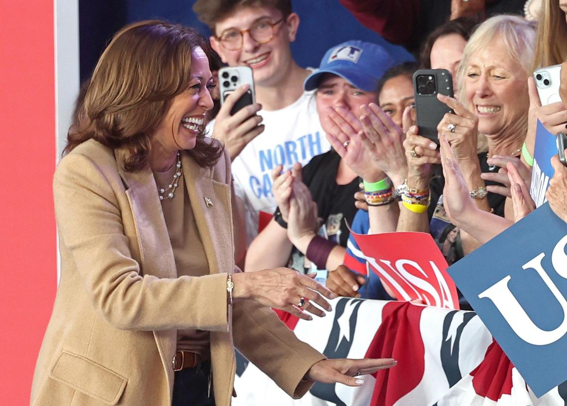 Vice President Kamala Harris shakes hands with supporters during a rally at PNC Music Pavilion on Saturday, November 2, 2024.