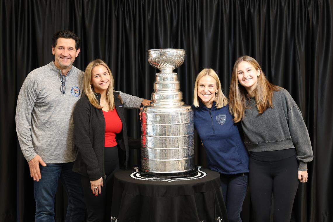 Tera Black, the Chief Operating Officer of the Charlotte Checkers (center right), poses with the Stanley Cup on Saturday, December 21, 2024, with her family.