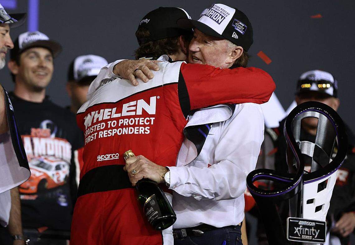 Jesse Love, driver of the No. 2 Whelen Chevrolet, and NASCAR Hall of Famer and RCR team owner, Richard Childress embrace in victory lane after winning the NASCAR Xfinity Series Championship at Phoenix Raceway on November 01, 2025 in Avondale, Arizona.