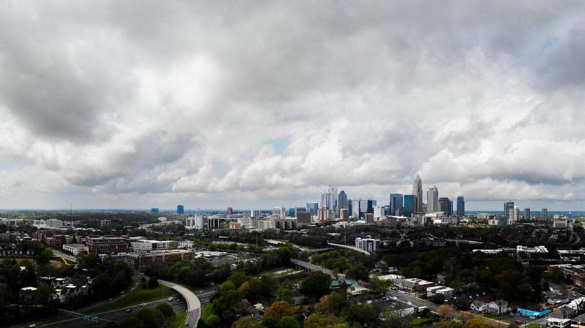 A composite image shows rain clouds over the skyline in Charlotte, NC, on Thursday, April 7, 2022.