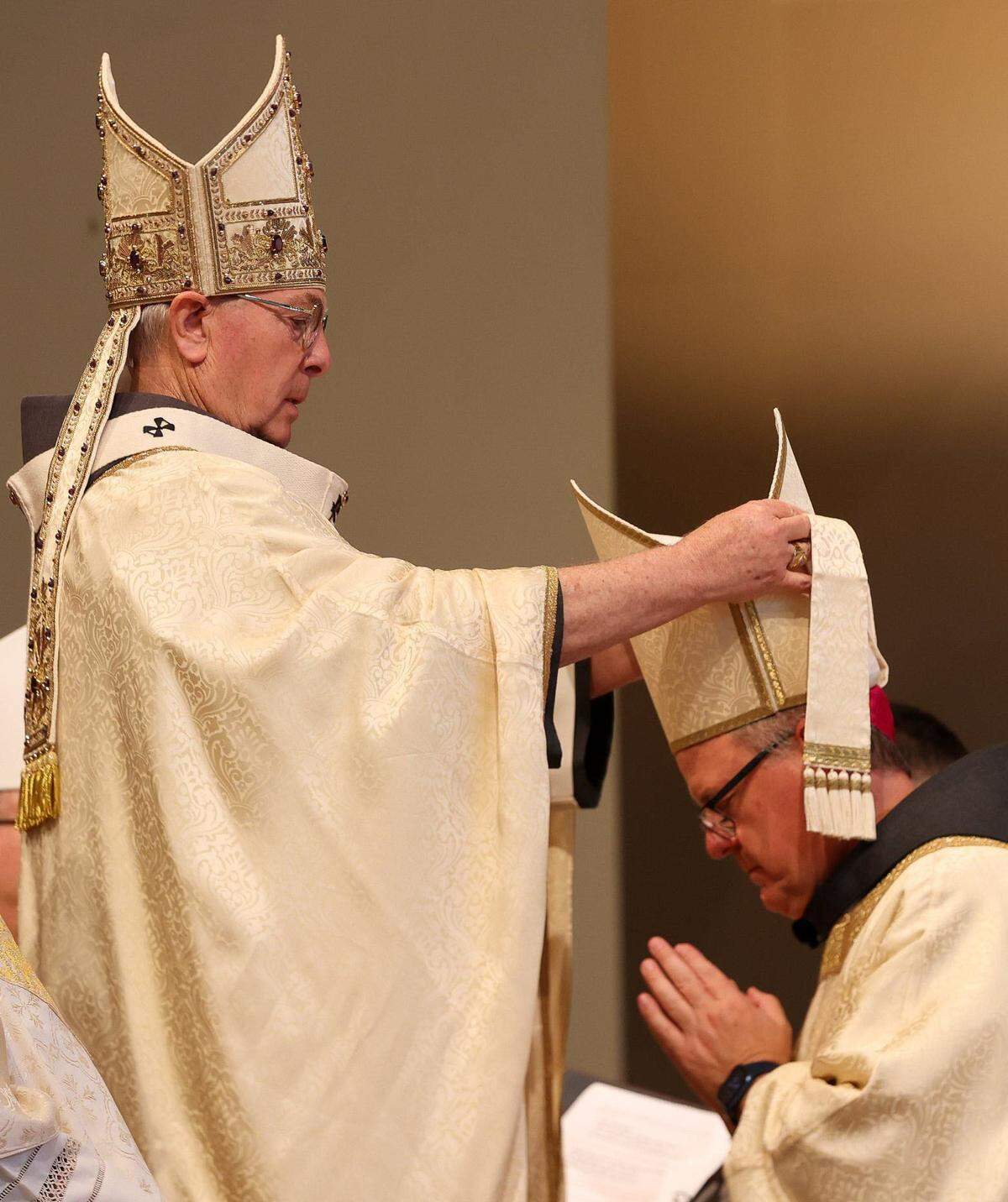 Archbishop Gregory Hartmayer of Atlanta places a miter on Bishop Michael T. Martin’s head at Saint Mark Catholic Church in Huntersville, North Carolina on May 29, 2024. The miter is a symbol of the office of Bishop.