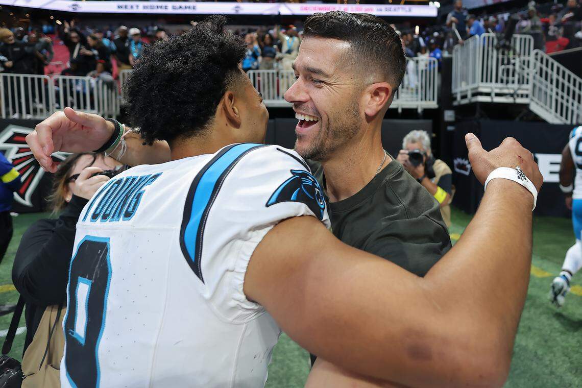 Carolina Panthers head coach Dave Canales and quarterback Bryce Young celebrate after Sunday’s overtime win against the Atlanta Falcons at Mercedes-Benz Stadium in Atlanta.