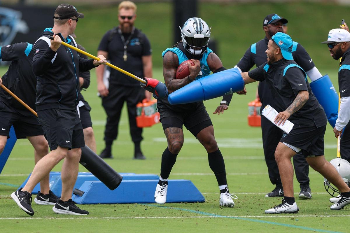 Panthers wide receiver ALaviska Shenault, Jr., center, runs through an obstacle during the first day of mandatory mini camp on Tuesday, June 13, 2023 at the practice fields behind Bank of America Stadium.