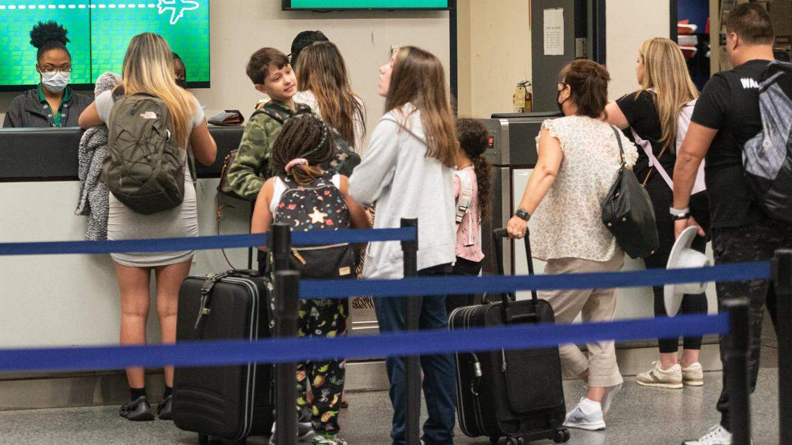 Lines form at ticket counters at the Charlotte Douglas International Airport. Transportation Security Administration officials are expecting a busy summer at the airport.