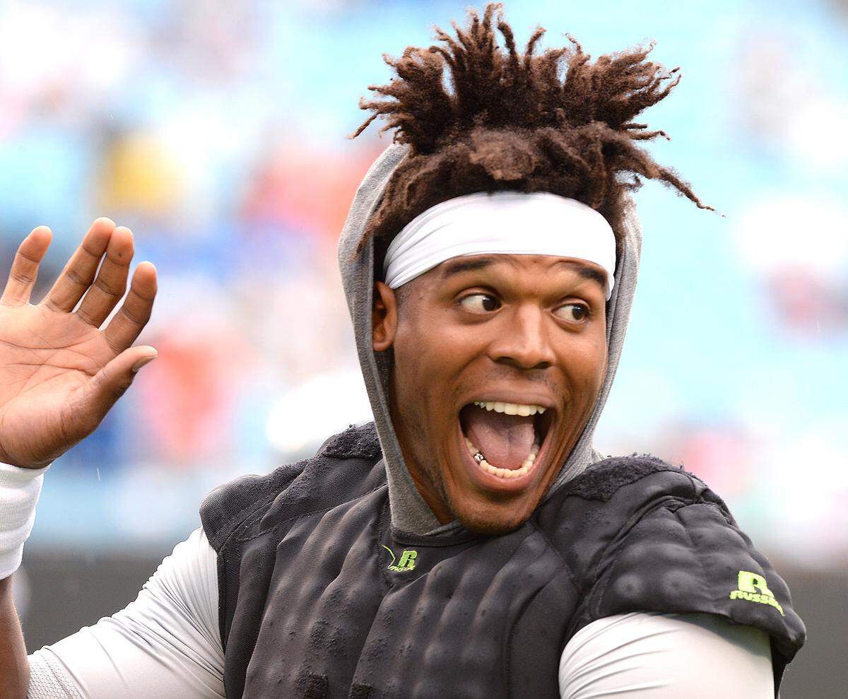 Carolina Panthers quarterback Cam Newton waves to the cheering fans prior to the start of the team’s Fan Fest at Bank of America Stadium on Friday, August 2, 2019.