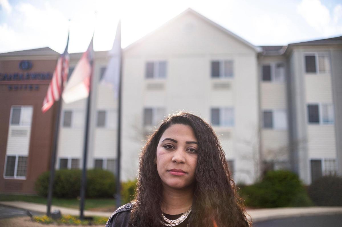 Geeta Amiri in front of a hotel that houses several families who fled Afghanistan and are resettling in North Carolina. Amiri heard about the families who were arriving in Charlotte and felt she could help. She says some are having problems with food, transportation and access to much needed medical care. Photo from Dec. 27, 2021.