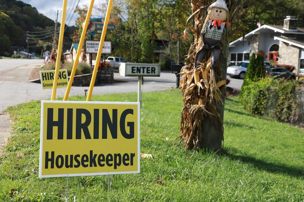 Help-wanted signs lining the street in front of the Meadowlark Motel.