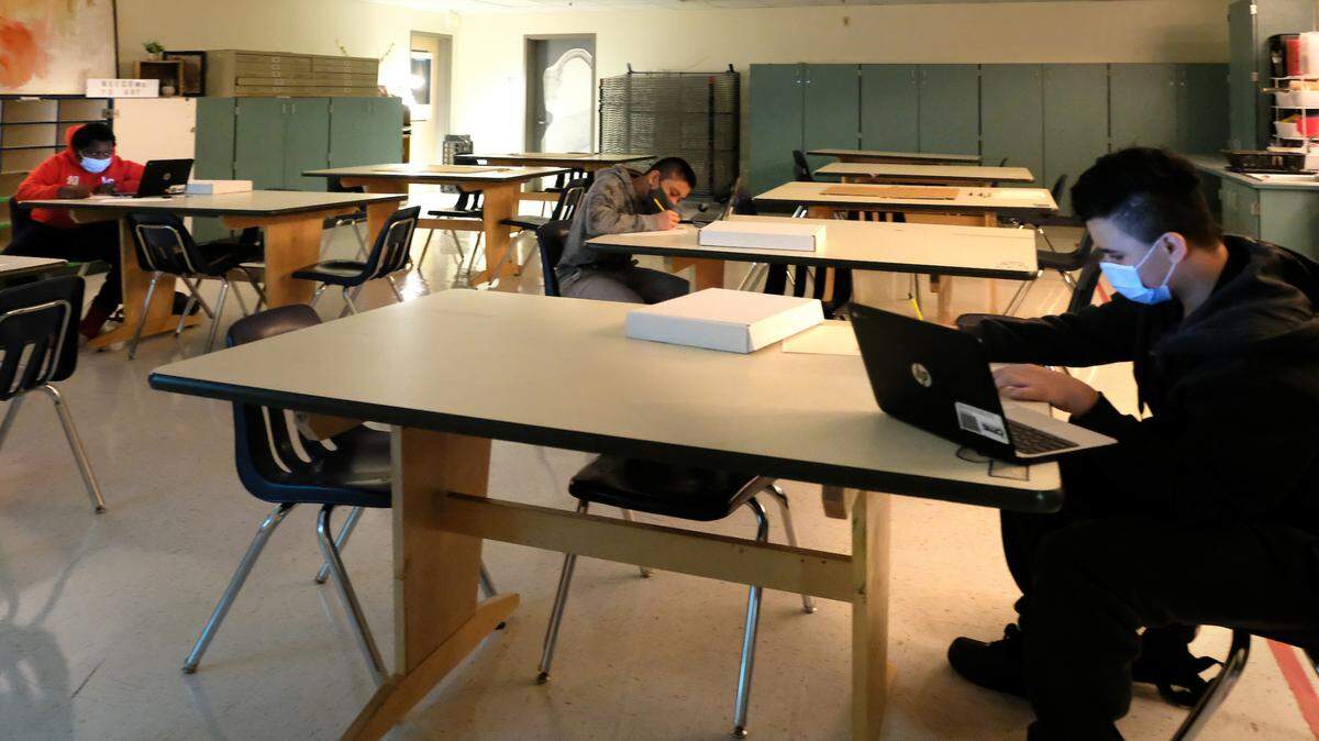Students socially distance at Charlotte-Mecklenburg Schools’ Eastway Middle in teacher Freddie Jolly’s art class.