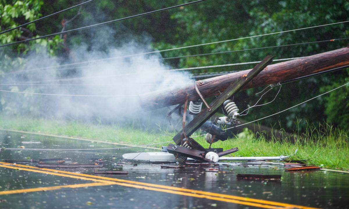 A power line that fell onto Freedom Drive near the Woodford Green neighborhood in Charlotte, N.C., on August 8, 2024.