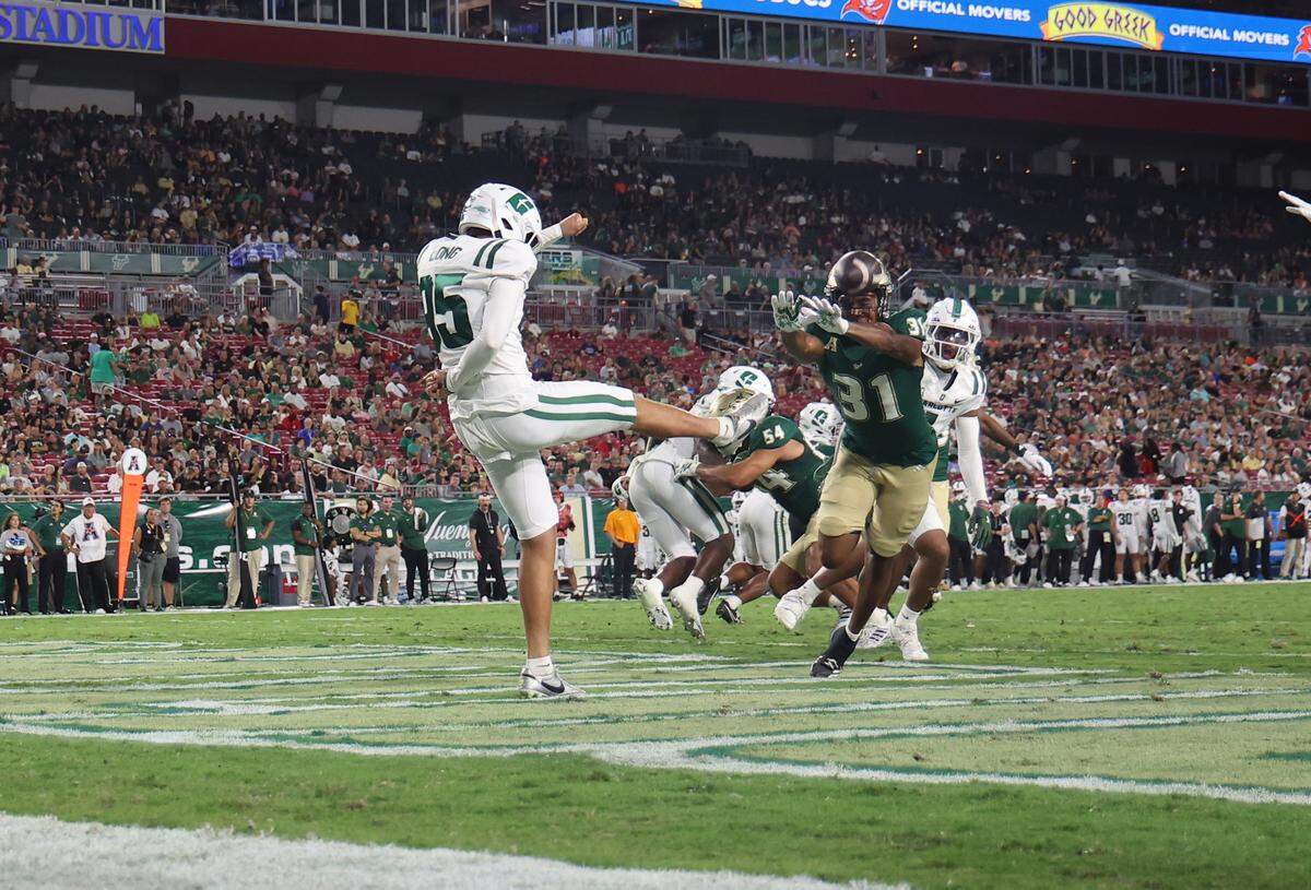 South Florida Bulls defensive back Jair Murphy (31) blocks a punt from Charlotte 49ers punter Bronson Long (95) for a safety during the first quarter at Raymond James Stadium. 