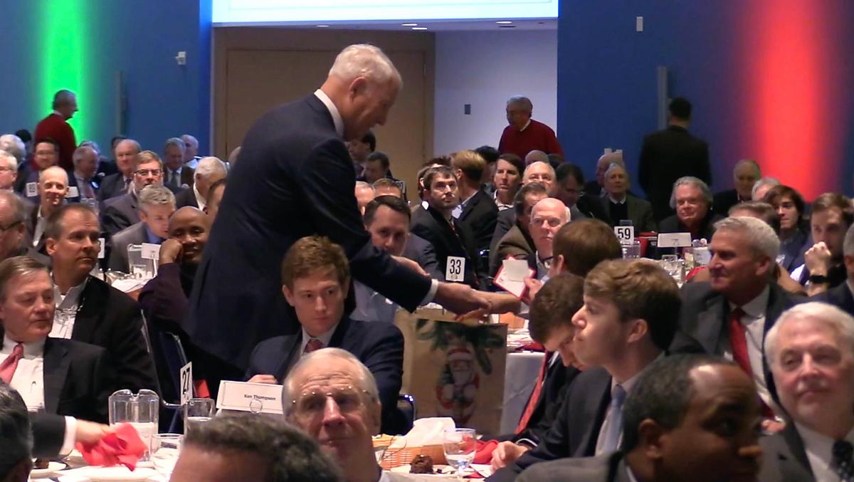 A collector goes between tables gathering donations during the 102nd annual Good Fellows Club Christmas Luncheon in the Crown Ballroom of the NASCAR Hall of Fame on Wednesday, December 12, 2018. The event raises money for local families in emergency need throughout the year, primarily with rent and utility payments to keep them from living on the streets. Founded in 1917, the Good Fellows Club has about 1,700 members in the greater Charlotte area, men who’ve raised $3.6 million in the past five. The club assisted 2,479 families in 2017.