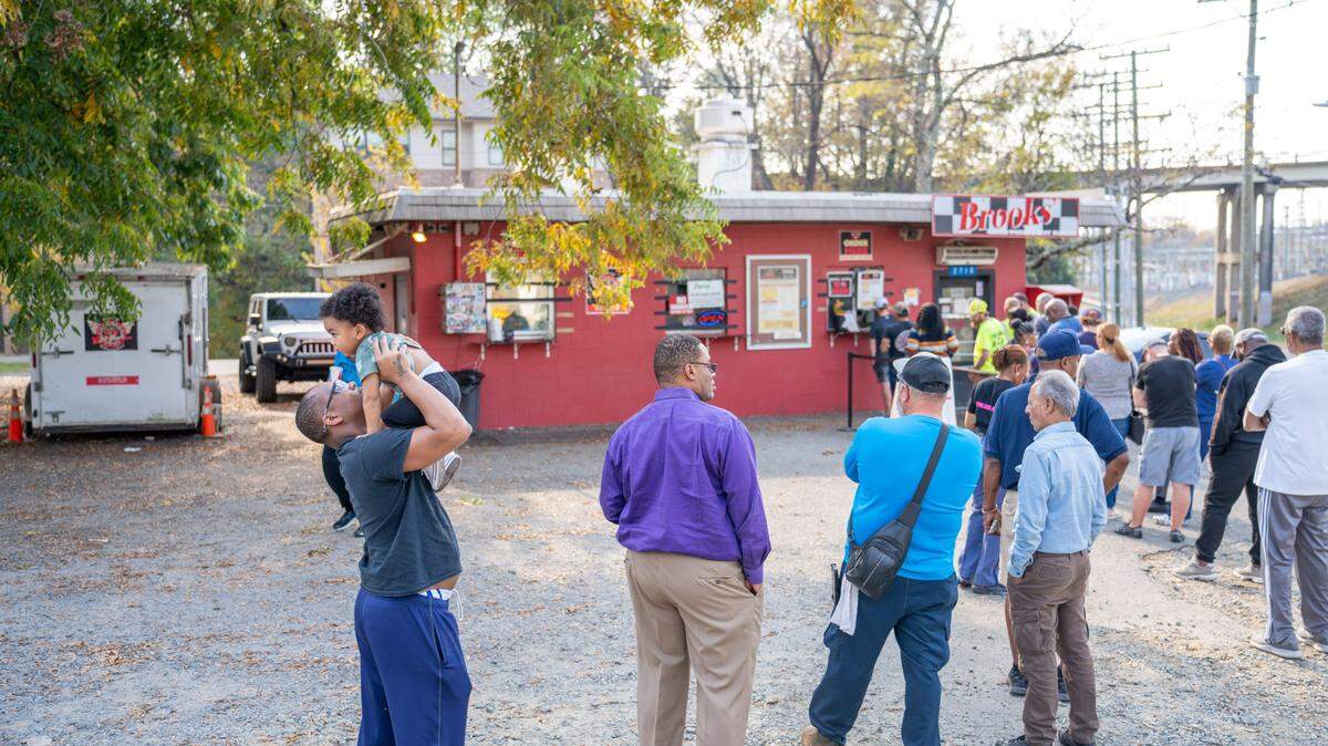 People waiting in line to order lunch at Brooks’ Sandwich House on Wednesday, the day after the land was listed for sale.
