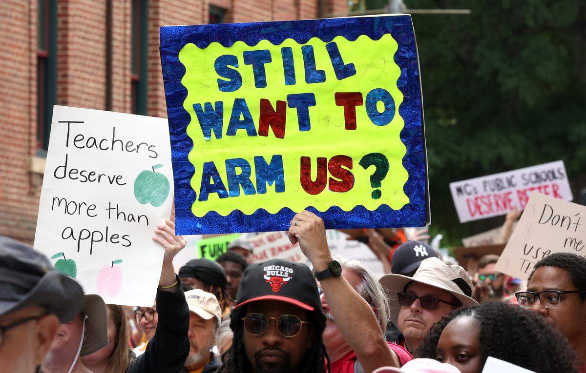 Signs, signs, signs were everywhere as teachers rallied at the Government Complex in Raleigh.
