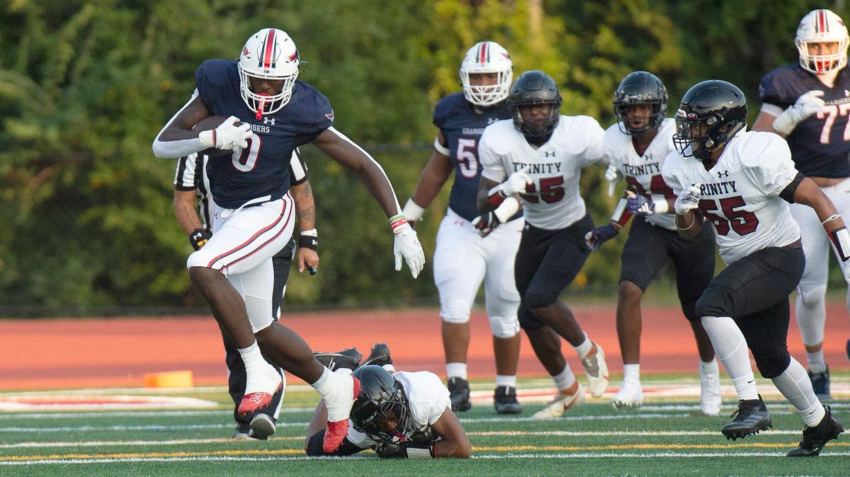 Providence Day tight end, #0, Kendre Harrison, campers for a long gain in the first half Friday evening. Providence Day lead Trinity Christian 27-8 at the end of the first half. The Trinity Christian Crusaders came to Charlotte from Fayetteville, N.C. to face off against the nationally ranked Providence Day School Chargers in the first game of the high school football season on Friday, August 16, 2024.
