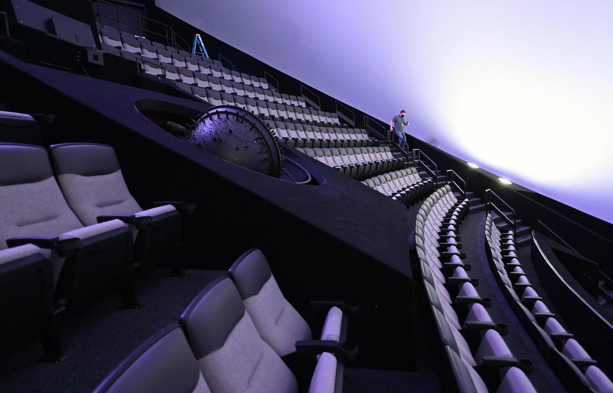 Brian Hester, Director of Theatre Operations at Discovery Place walks through the IMAX Dome Theatre on Thursday, January 27, 2022. The theatre has gone undergone renovations and a new name change.
