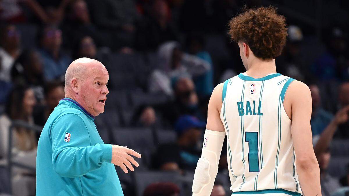 Charlotte Hornets head coach Steve Clifford, left, speaks with guard LaMelo Ball, right, during first half action against the Washington Wizards on Monday at Spectrum Center.