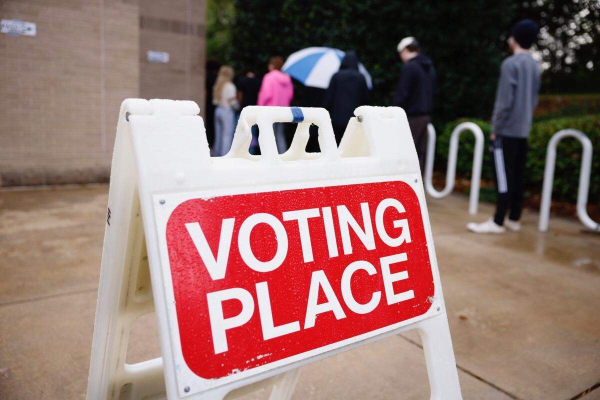 A voting sign points voters to the poll at Charlotte Mecklenburg Library at University City on Tuesday.