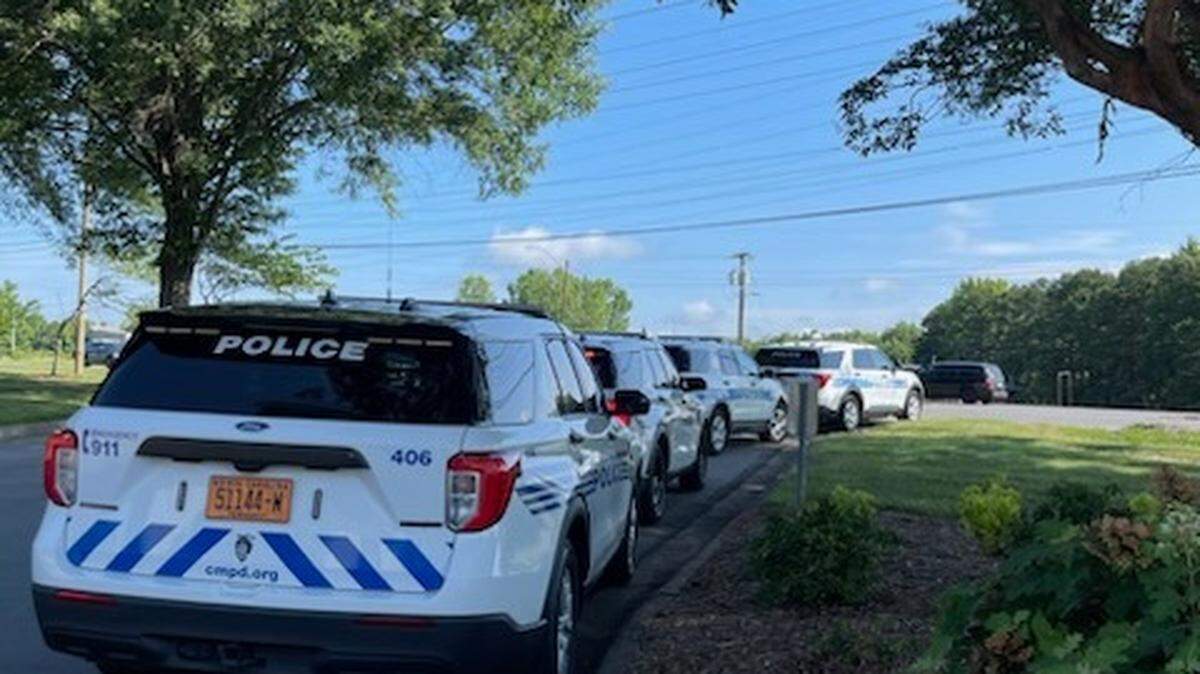 CMPD received a call about a suspect barricated in an apartment. An armed female was shot at by an officer who entered the apartment, officials said.