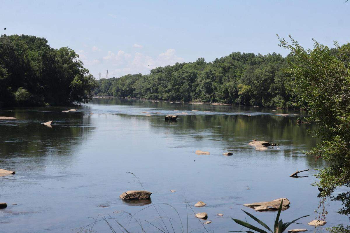 The Catawba River flows between Fort Mill and Camp Canaan in Rock Hill, S.C. Just nine months ago, parts of Camp Canaan were under 7 feet of water, with decades of work destroyed.