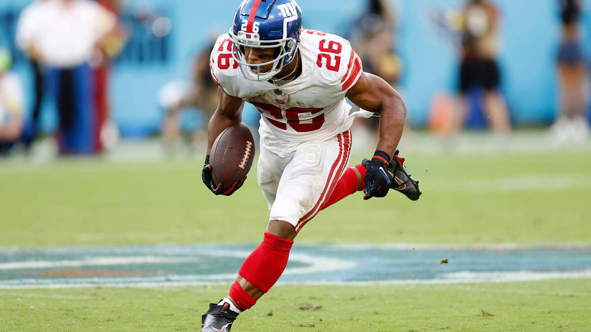 Running back Saquon Barkley (26) of the New York Giants runs the ball during the second half against the Tennessee Titans at Nissan Stadium on Sunday, Sept. 11, 2022, in Nashville, Tennessee. (Wesley Hitt/Getty Images/TNS)