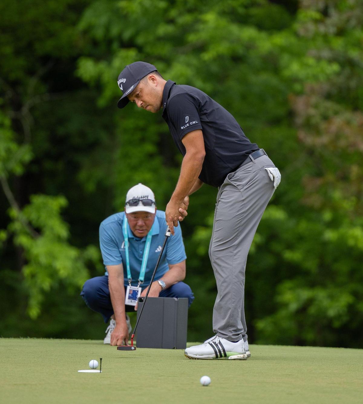 Xander Schauffele putts on the 12th hole during the second practice day at the 107th PGA Championship at Quail Hollow in Charlotte, N.C., on Wednesday, May 14, 2025.
