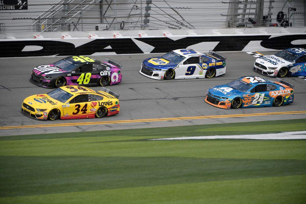Jimmie Johnson, in car No. 48, at a 2020 practice session for the Daytona 500. His 2006 Daytona 500 win marked a pivotal moment for his career, and he later commissioned a piece of art to be made from his racing suit from that day.