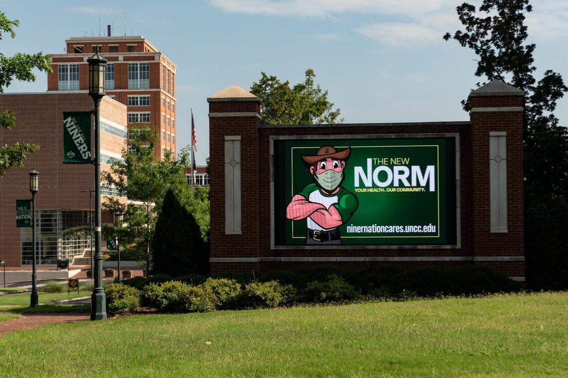 A sign depicting the school’s mascot wearing a mask is seen on the campus of UNC-Charlotte on Monday, July 20, 2020.