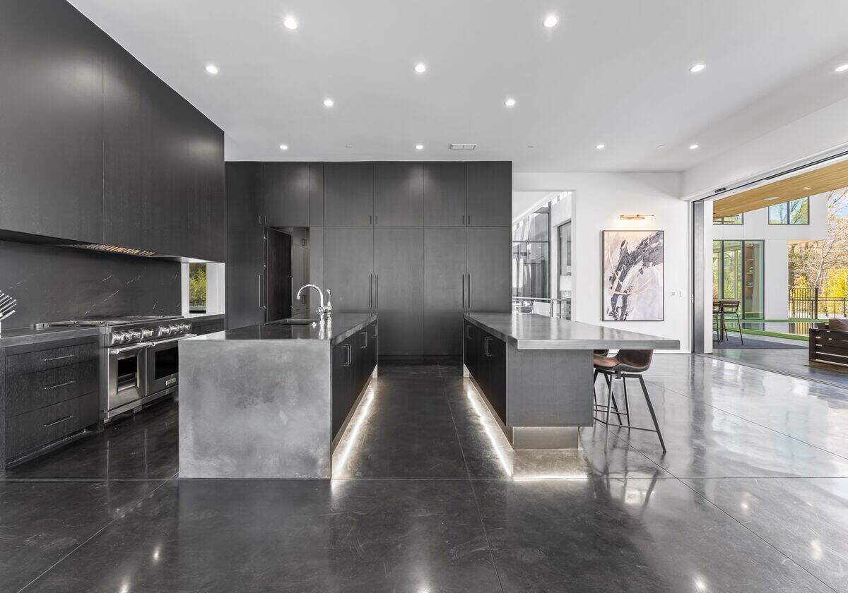 Secluded behind two gates, the property includes two detached spaces for a guest suite, studio, or office.