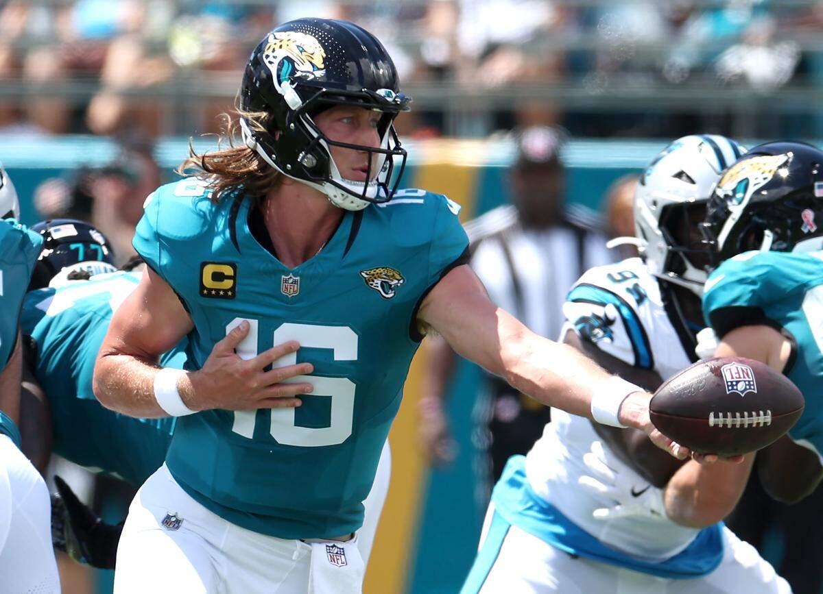 Jacksonville Jaguars quarterback Trevor Lawrence hands the ball off to a running back during action against the Carolina Panthers on Sunday, September 7, 2025 at Everbank Stadium in Jacksonville, Florida.