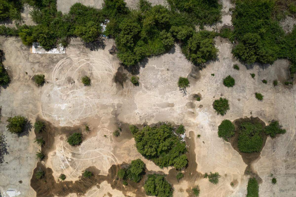 A bird’s eye view shows vegetation growing at the old Eastland Mall site. The site is now a busy construction site. The project is one of a few large development projects happening in east Charlotte.