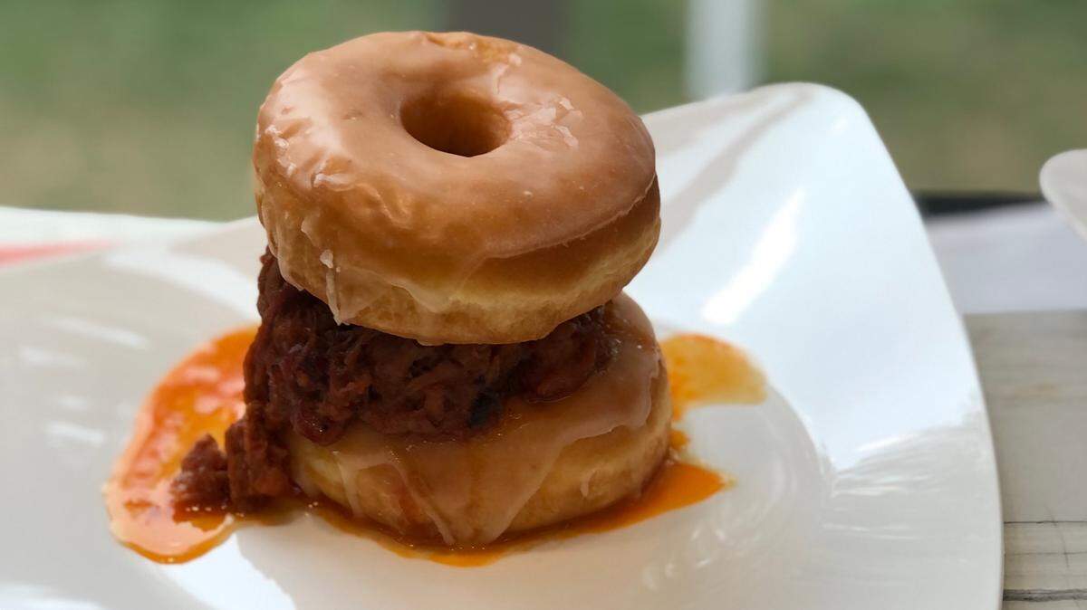 Barbecue pulled pork on a glazed doughnut sandwich.