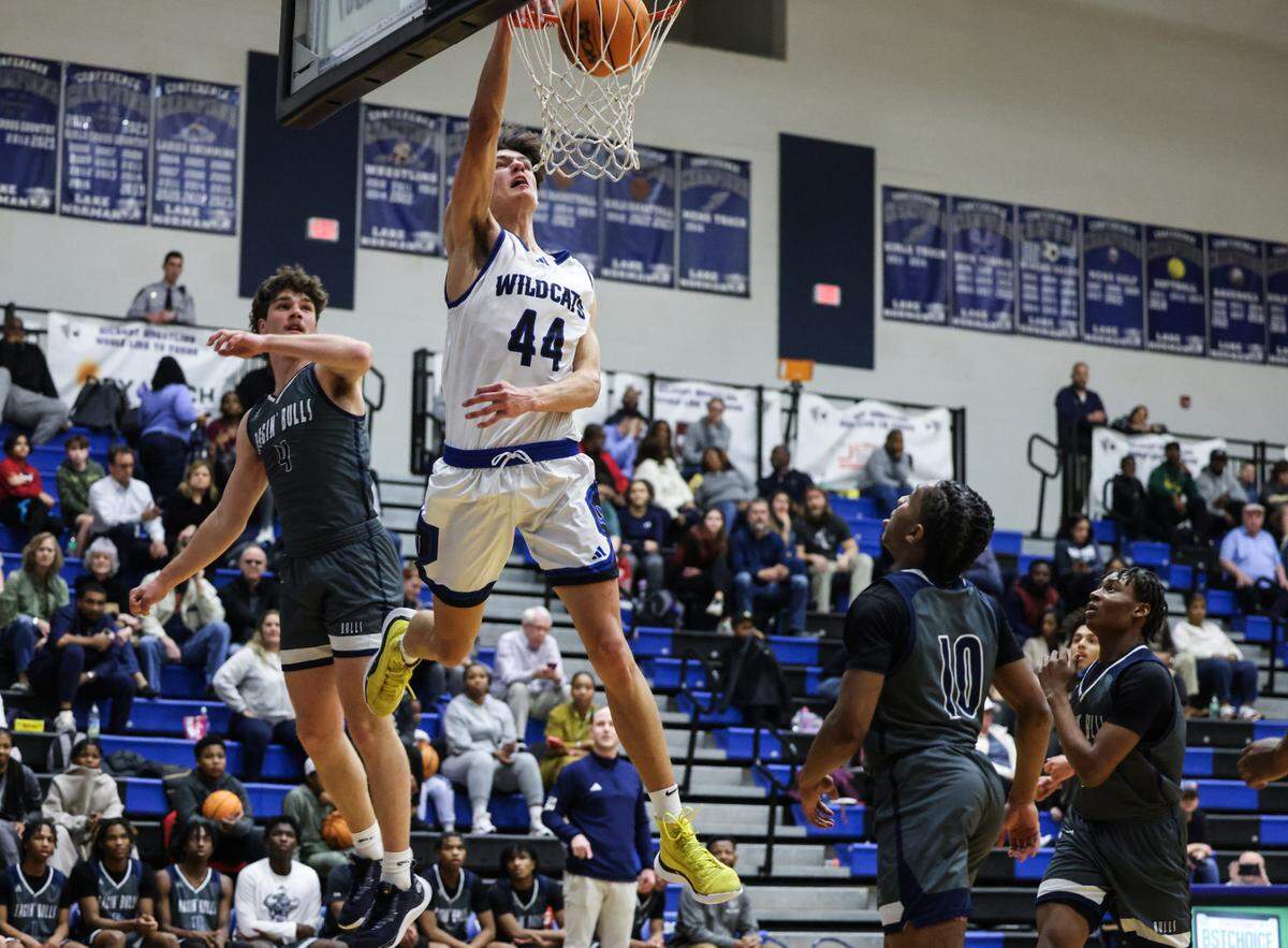 Lake Norman Wildcats Trent Steinour dunks against the Hickory Ridge Ragin’ Bulls at Lake Norman High School in Mooresville, N.C., on Tuesday, February 6, 2024.