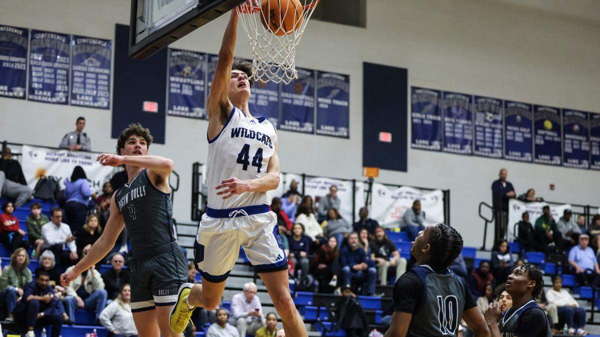 Lake Norman Wildcats Trent Steinour dunks against the Hickory Ridge Ragin’ Bulls at Lake Norman High School in Mooresville, N.C., on Tuesday, February 6, 2024.