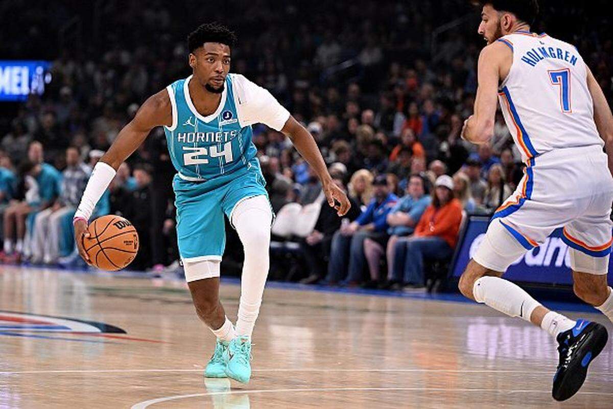 Brandon Miller of the Charlotte Hornets handles the ball against the Oklahoma City Thunder at Paycom Center.