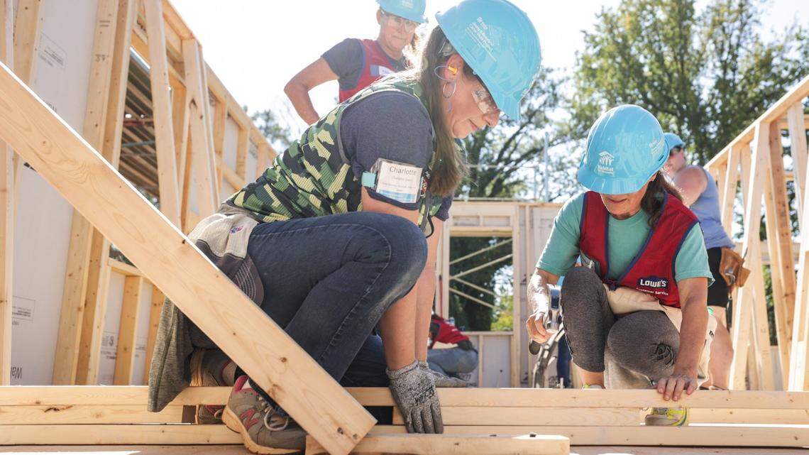 Volunteers work on a home for the 2023 Jimmy & Rosalynn Carter Work Project in the Meadows at Plato Price development in October. A variety of housing programs are available for residents in the Charlotte region, especially for first-time homeowners.