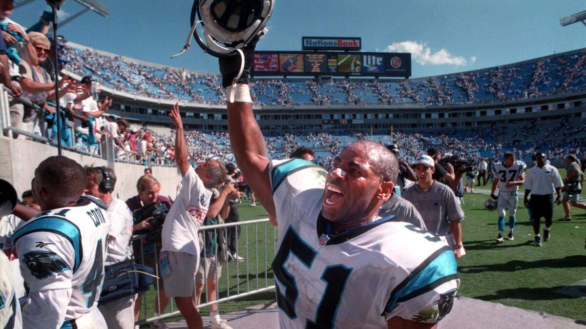 Sam Mills celebrates a Carolina Panther victory in 1996. Mills will be posthumously inducted into the Pro Football Hall of Fame Saturday in Canton, Ohio.