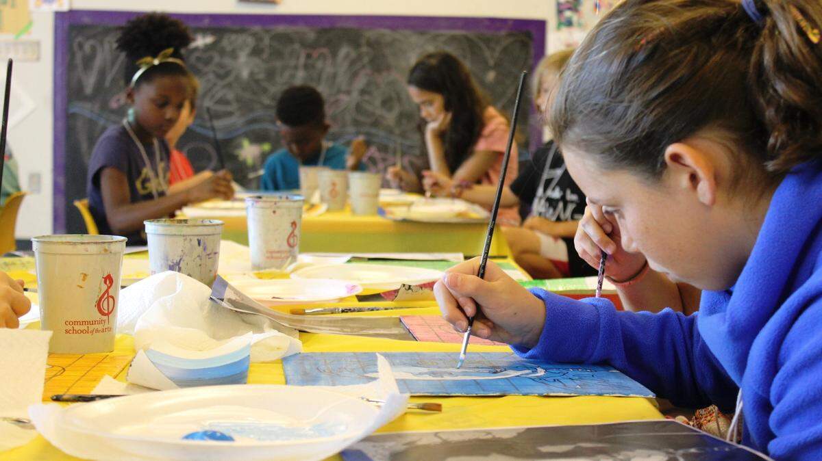 Local students work on an art project at a Community School of the Arts class. The organization is kicking off its 50th-year celebration with a new name but the same mission: arts education for all.