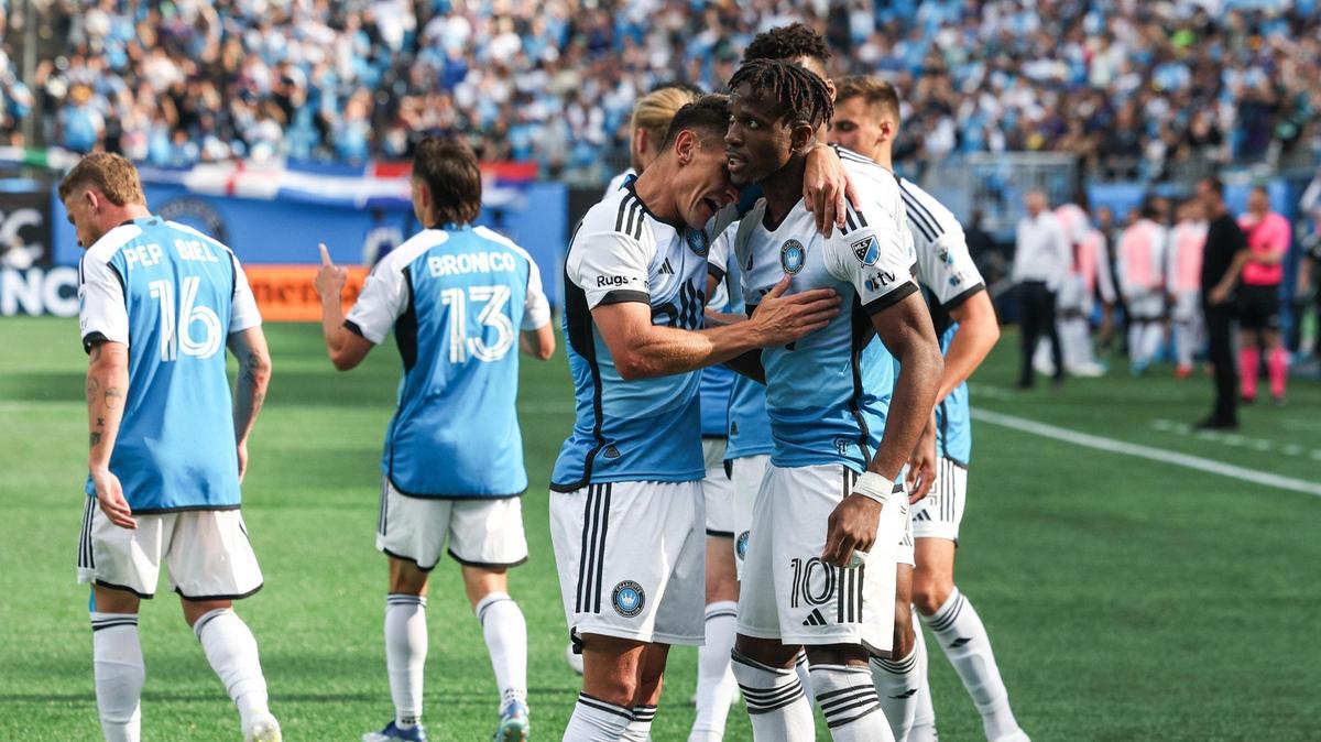 Charlotte FC’s Ashley Westwood, left, hugs teammate Wilfried Zaha after Zaha scored in his first match with the team. Charlotte FC defeated Atlanta United, 2-0.